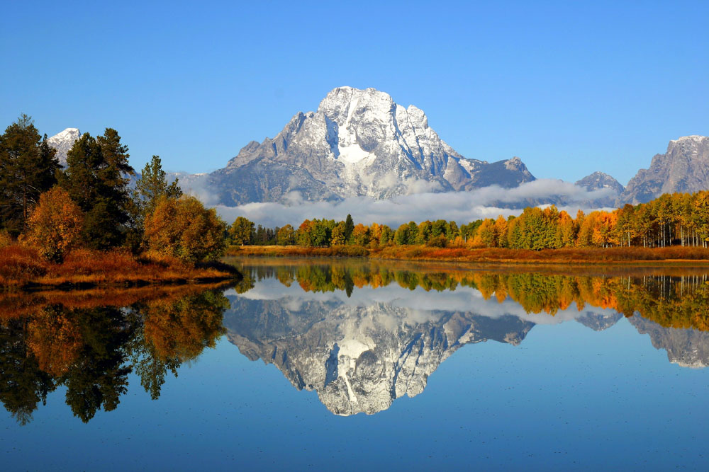 THE 5 BEST PLACES TO VISIT IN THE US IN MAY, which-places-have-shoulder-season-in-usa-in-may-grand-teton-national-park, https://travelnbuddy.com/, https://travelnbuddy.com/index.php/web-stories/best-places-to-travel-in-may-in-usa/